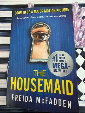 The Housemaid by Freida McFadden - Blue & Yellow Paperback